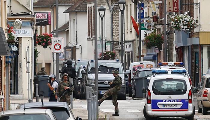 French soldiers stand guard near the scene of an attack in Saint-Etienne-du-Rouvray, Normandy, France, on July 26, 2016.
