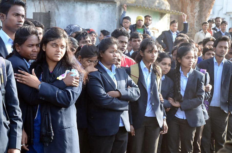 Students gathered after a girl student found dead