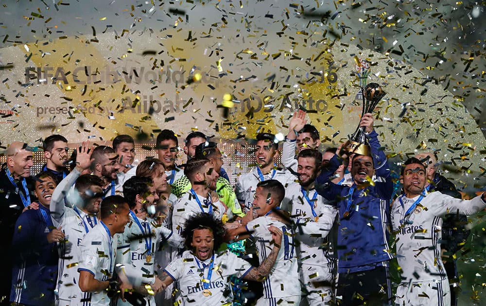 Real Madrid players celebrate after defeating Kashima Antlers in the final