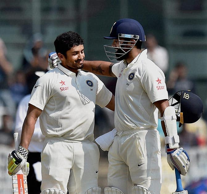 Karun Nair being congratulated by teammate Murali Vijay