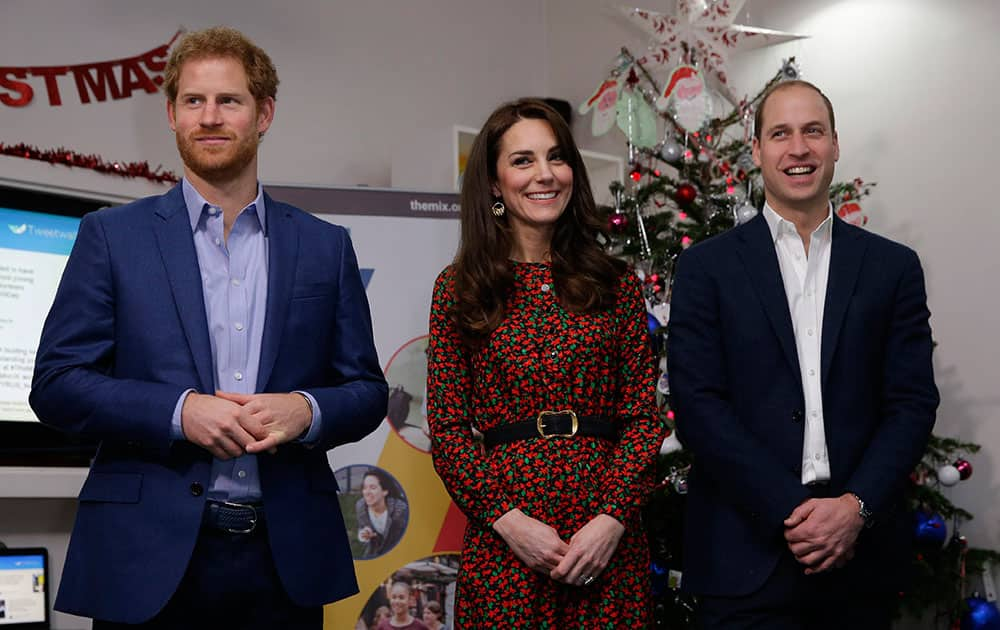 Britains Prince William, Kate and Prince Harry