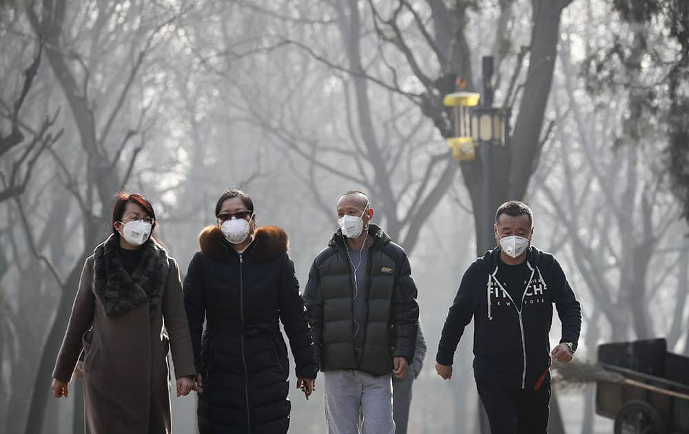 Chinese people wearing masks for protection against pollution exercise