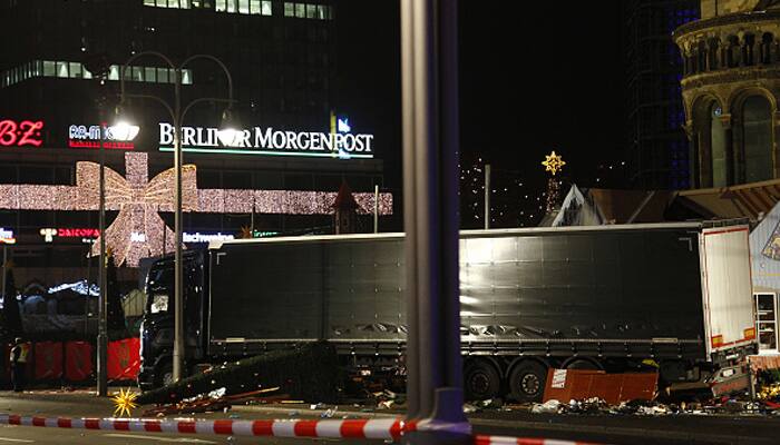 Berlin Christmas market carnage was `terrorist act` likely by asylum seeker: Angela Merkel