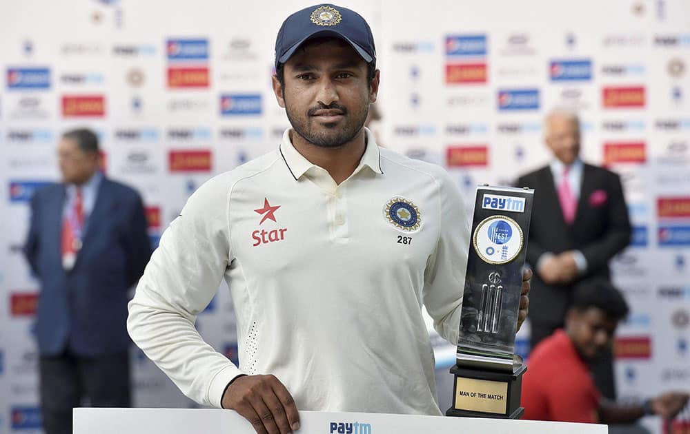 Karun Nair poses with man of the match trophy after winning the test series at MAC Stadium in Chennai