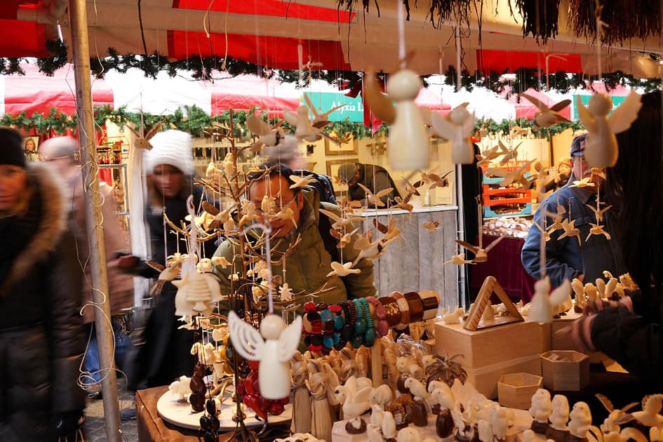 People shop at an outdoor holiday