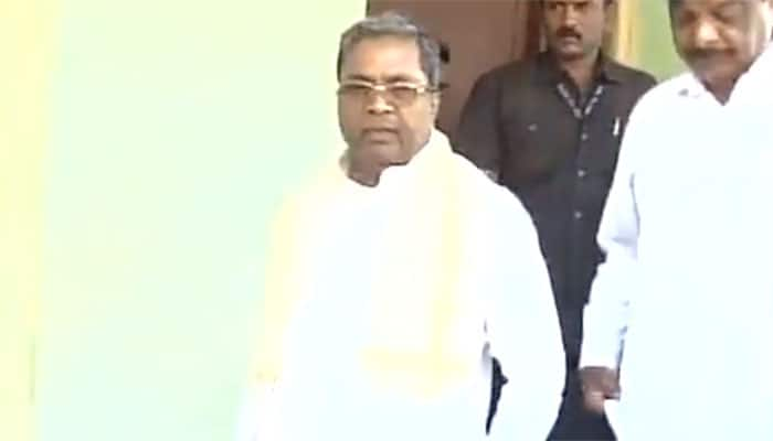 Karnataka CM Siddaramaiah caught on camera getting his shoelaces tied by man