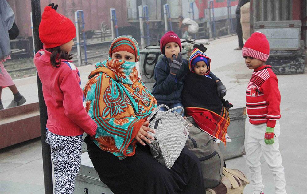 Passengers wait for their trains in Allahabad