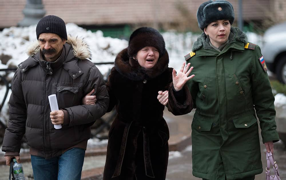 Relatives cry in front of the Alexandrov Ensemble building