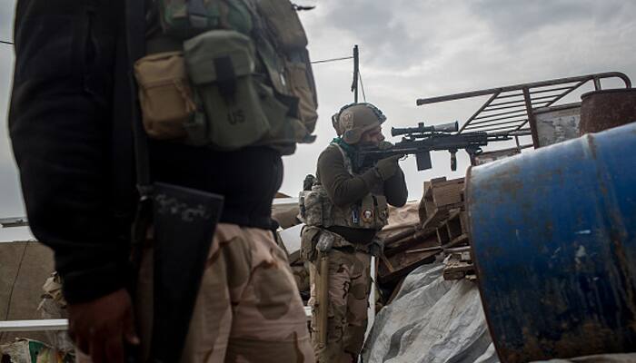 Iraq forces fight muddy street battle against Islamic State in Mosul