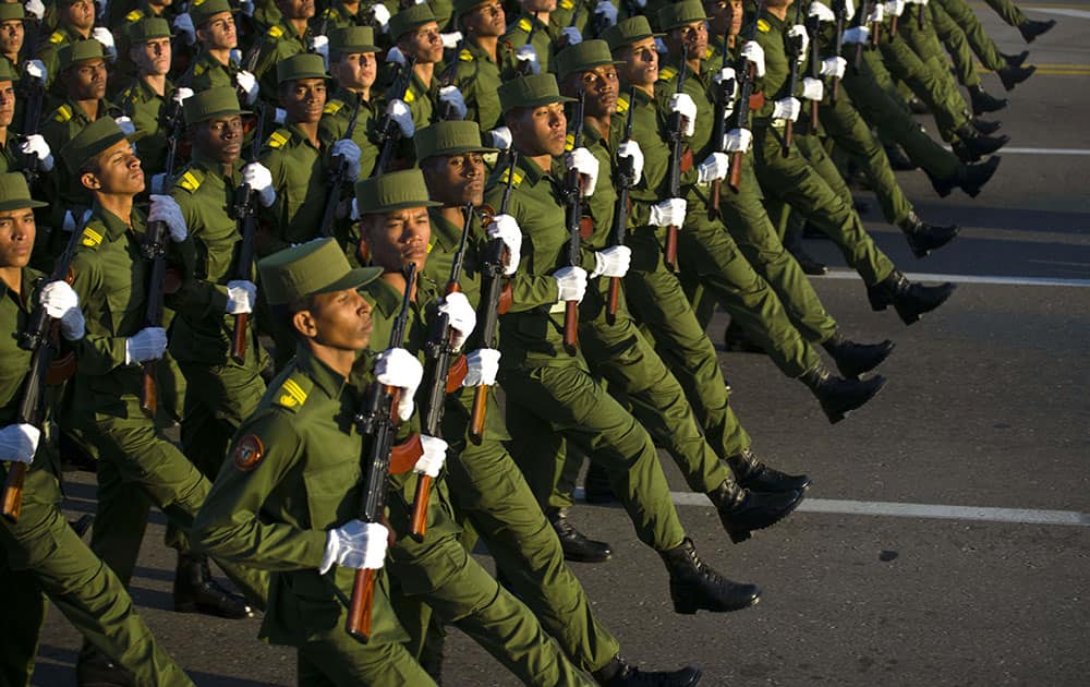 Soldiers march through Revolution Square in honor of late Cuban leader Fidel Castro