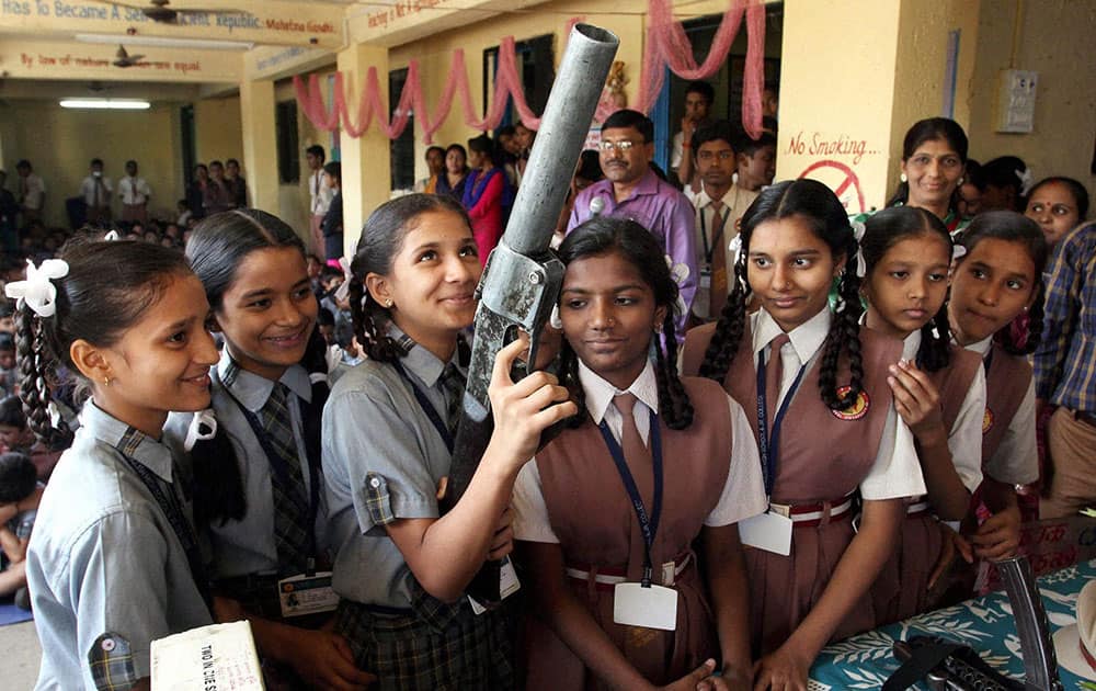 Children having look on police arms and equipments 