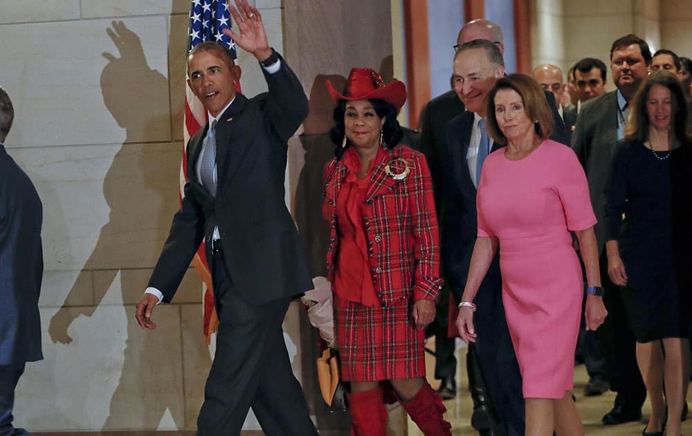 President Barack Obama waves as he arrives on Capitol