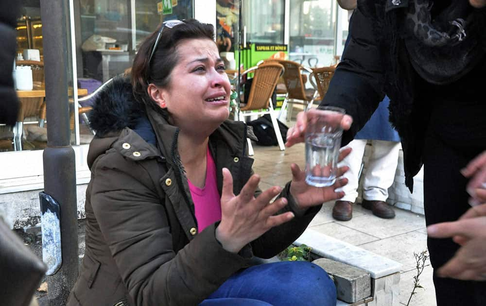 A woman reacts at the explosion site in the Aegean