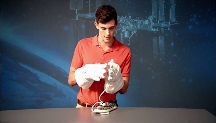 NASA makes people try on spacesuit gloves and learn what it feels like to perform a spacewalk the hard way!