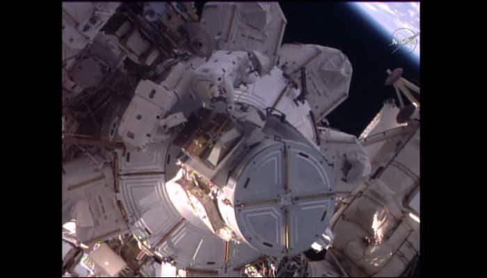 ISS astronauts Shane Kimbrough and Thomas Pesquet mark spacewalk completion with an orbital high-five!