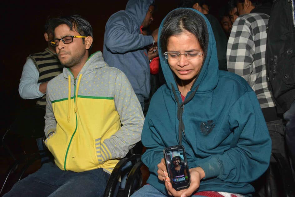 Family members crying for their missing relatives