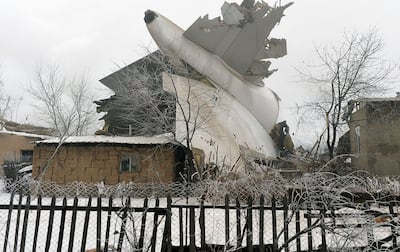 The tail of a crashed Turkish Boeing 747 cargo plane lies at a residential area outside Bishkek, Kyrgyzstan