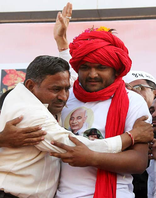 Hardik Patel, being hugged at a rally