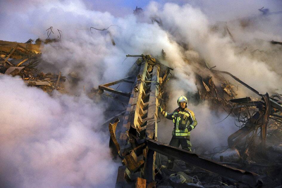 building engulfed by a fire and collapsed in Iran