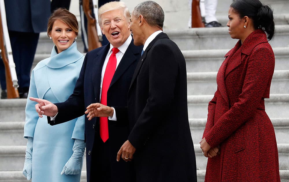 President Donald Trump and first lady Melania Trump talk with former President Barack Obama and Michelle Obama