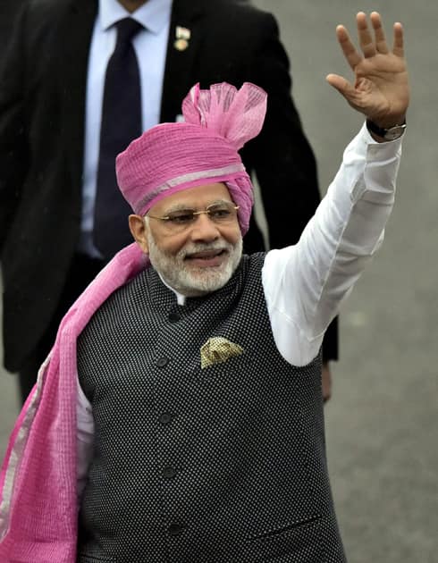 Prime Minister Narendra Modi waves to the crowd