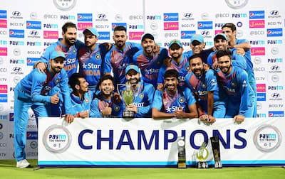 Virat Kohli with team mates with the trophy after winning the series against England