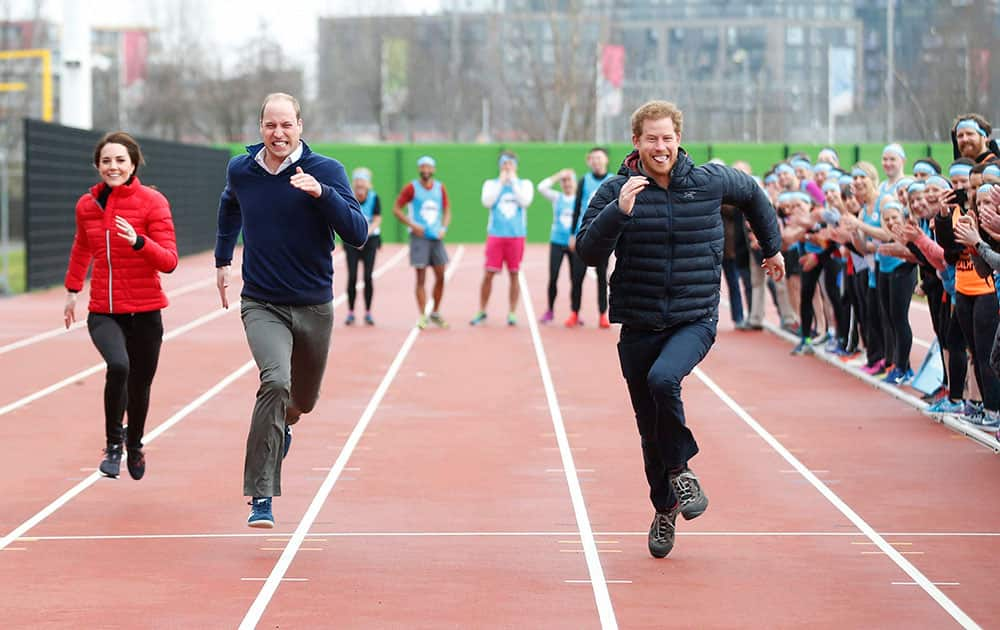 Britains Prince William, Kate, and Prince Harry take part in a relay 