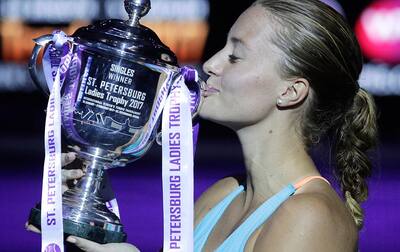 Kristina Mladenovic kisses her trophy