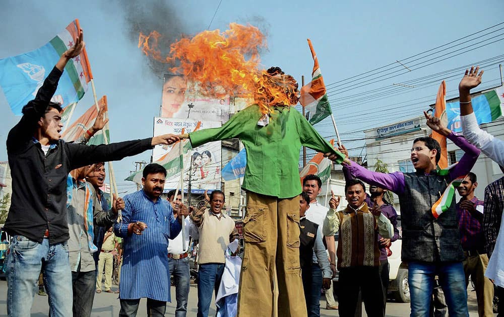 Tripura Pradesh Congress party workers burn an effigy at a protest rally against the Budget 2017