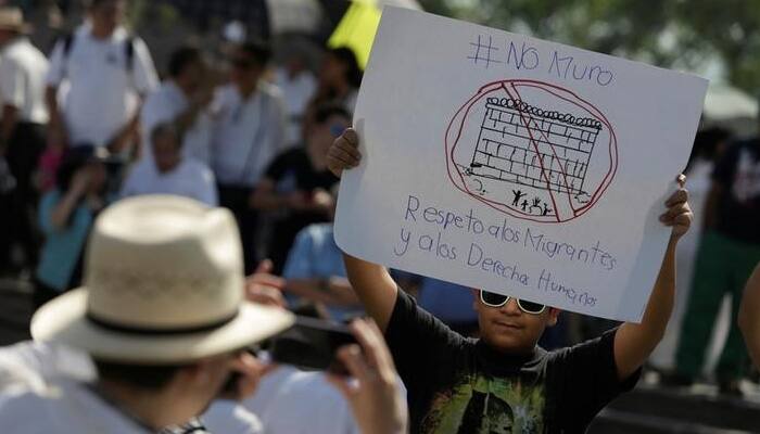 Marchers across Mexico vent anger over Donald Trump, and their own president