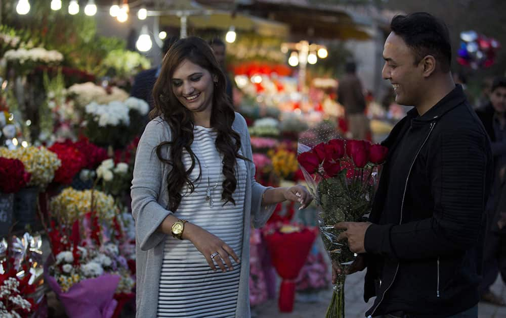 A couple buy flowers to celebrate Valentines Day