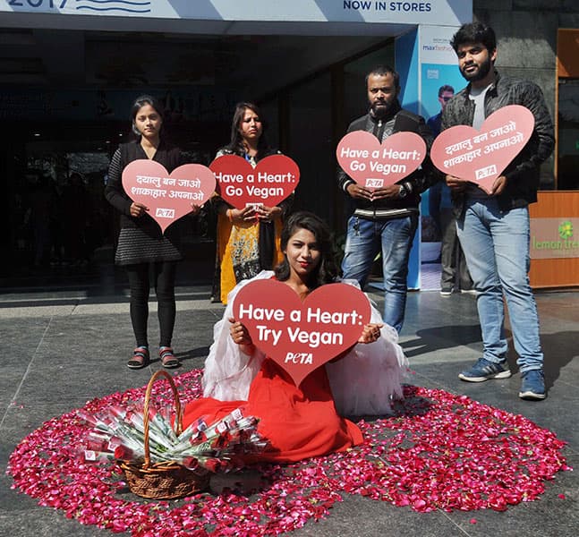 A PETA activist dressed as a Valentine angel asking people to stop cruelty against animals