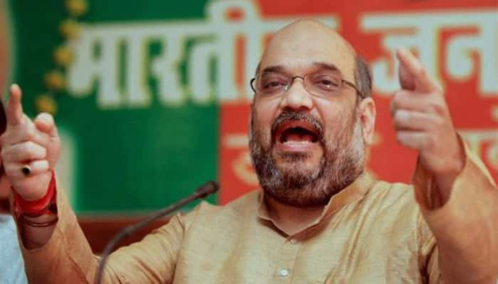 By forging an alliance of two &quot;corrupt families&quot;, Akhilesh Yadav has conceded defeat: Amit Shah