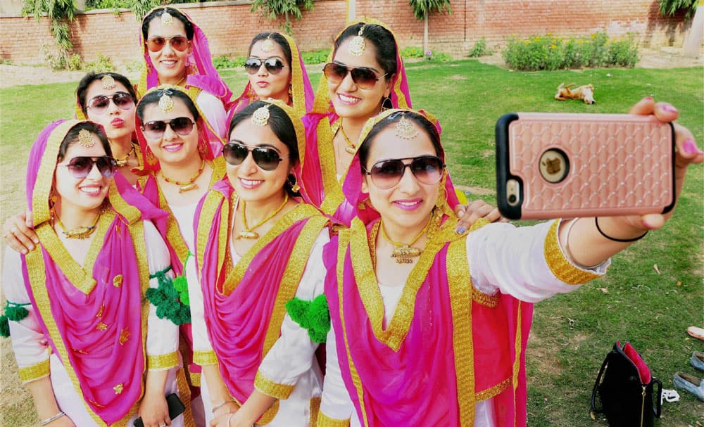 Girls pose for selfie during Aura Cultural Program Girls pose for selfie during Aura Cultural Program