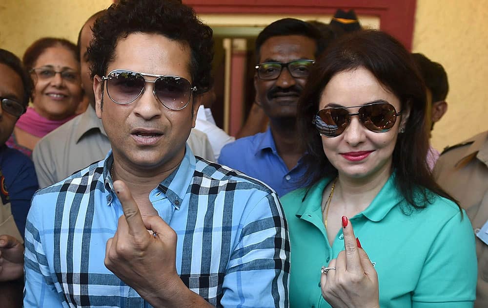 Cricket legend Sachin Tendulkar along with wife Anjali Tendulkar displays the indelible ink mark