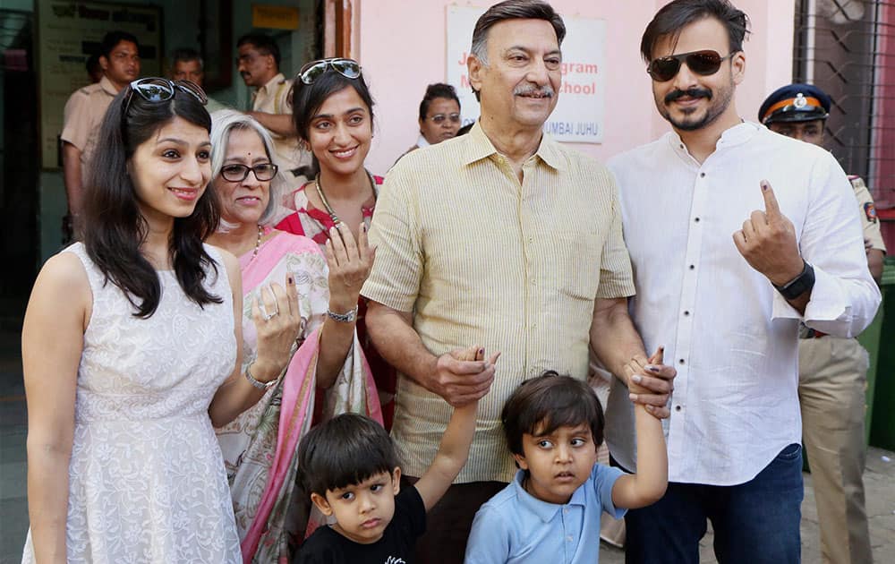 Vivek Oberoi, along with his father Suresh Oberoi, mother, sister, wife and sons after casting their votes at Juhu in Mumbai