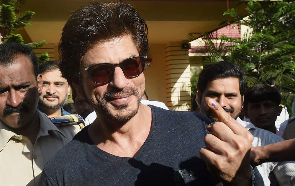 Shahrukh Khan showing his ink marked finger after casting the vote for the Municipal Corporation election in Mumbai