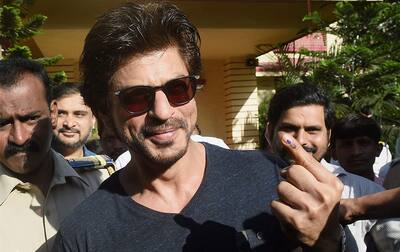 Shahrukh Khan showing his ink marked finger after casting the vote for the Municipal Corporation election in Mumbai