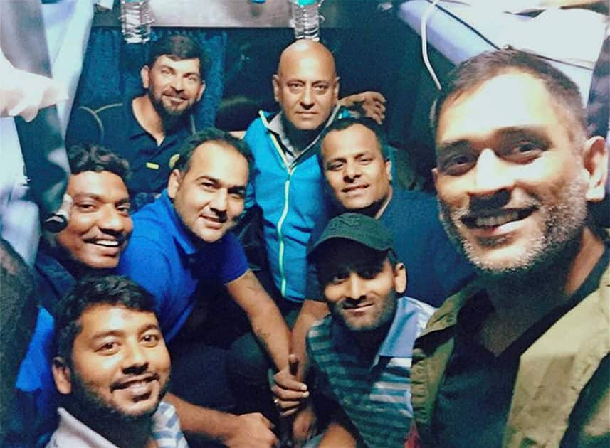 Jharkhand cricket team captain MS Dhoni with his team-mates while travelling in a train to Kolkata