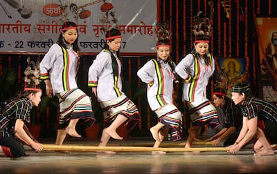 Artists from Mizoram perform their traditional Mizo Bamboo Cheraw dance at a cultural program in Allahabad