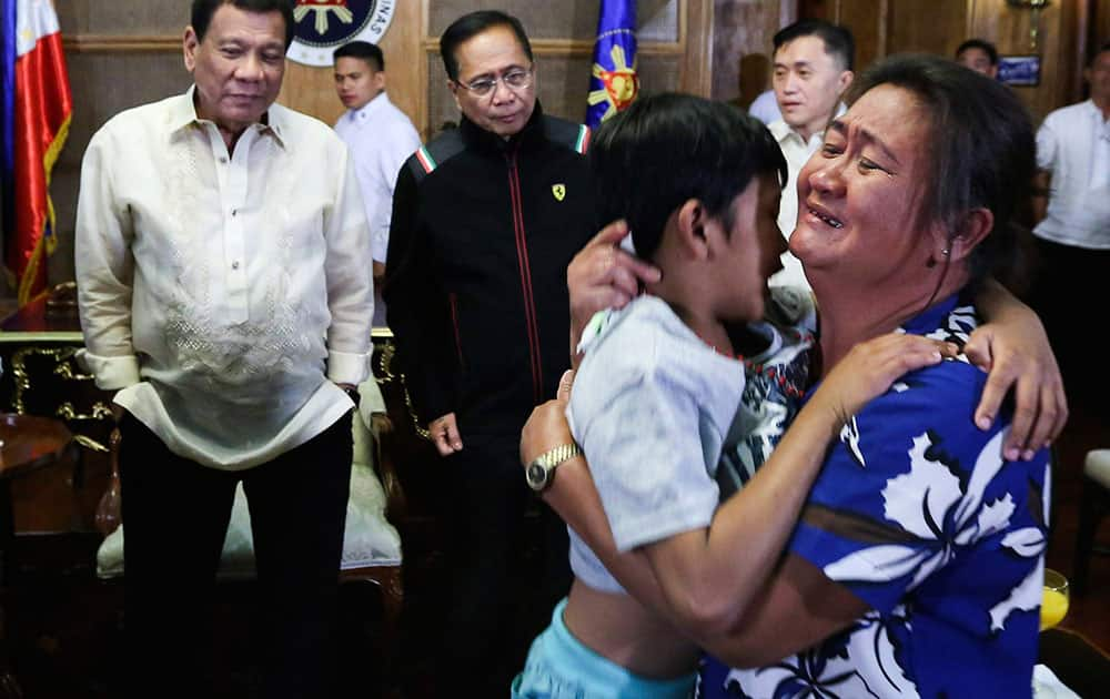 released Filipino hostage Rexon Romoc, 8-year-old boy kidnapped by the Abu Sayyaf in Payao