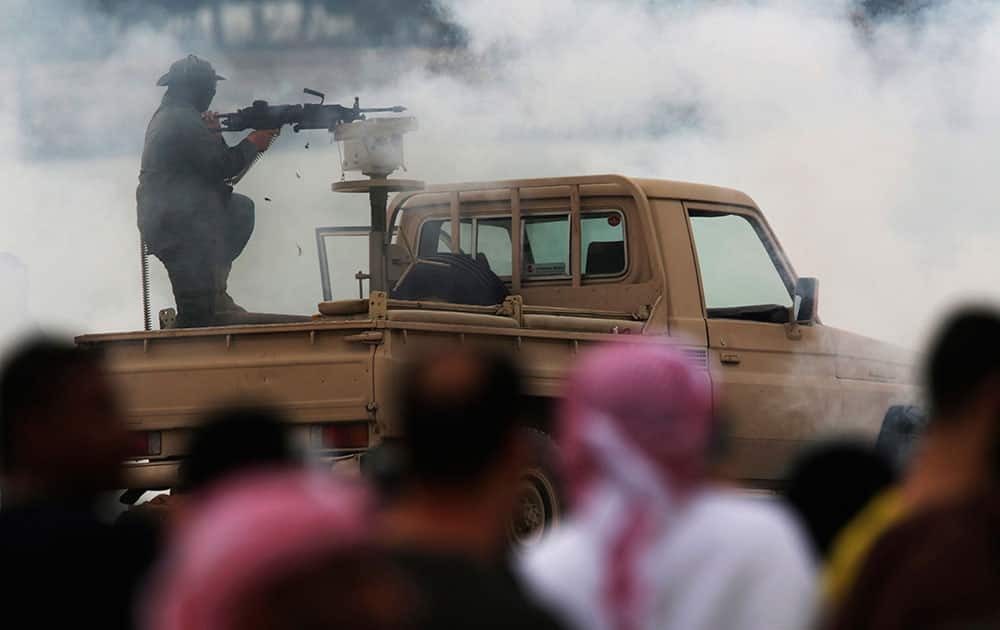 An Emirati soldier fires blanks as part of a military exercise in Abu Dhabi An Emirati soldier fires blanks as part of a military exercise in Abu Dhabi