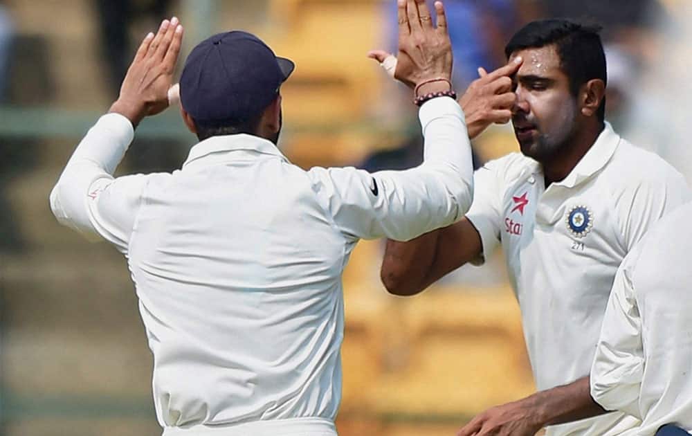 R Ashwin gestures after taking the wicket of Mitchell Starc