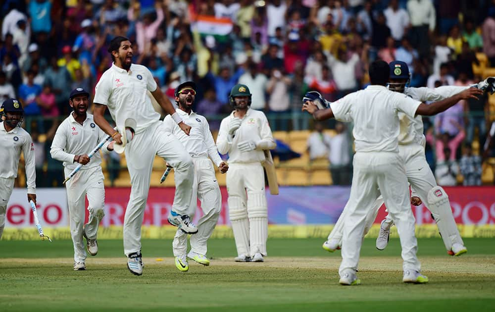 Indian players celebrate after R Ashwin dismissed Peter Handscomb