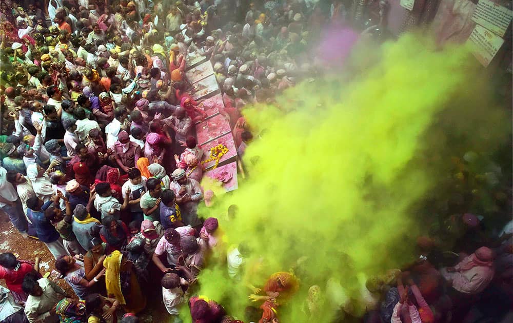 Devotees celebrate Holi festival at Bankey Bihari temple in Vrindavan