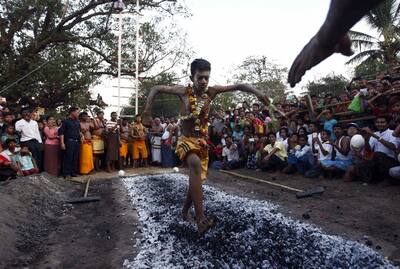 A hindu devotee walks on burning embers