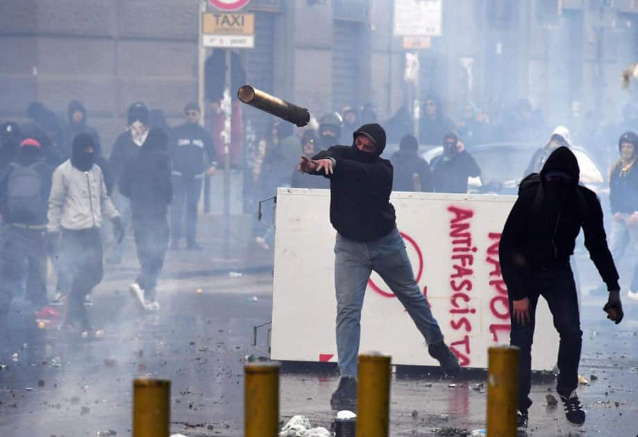 Protesters throw objects during clashes