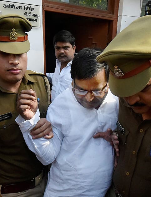 Gayatri Prajapati after being arrested by the police in connection with a rape case in Lucknow