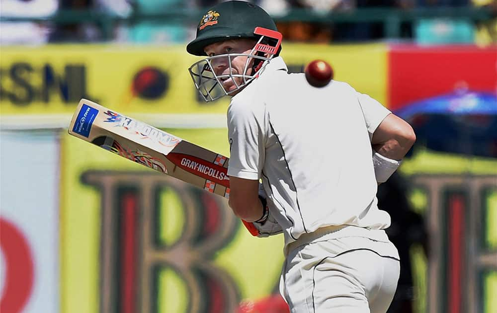 David Warner plays a shot during the 3rd day of last test match against India at HPCA Stadium in Dharamsala