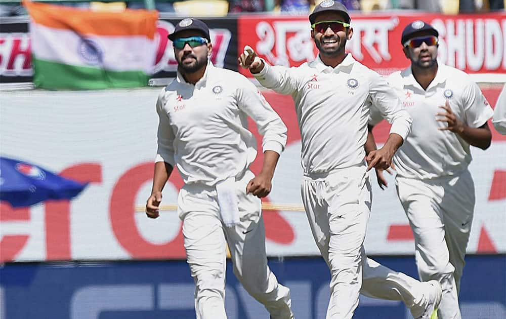 Rahane with teammate celebrate the wicket of Matt Renshaw during the 3rd day of last test match at HPCA Stadium in Dharamsala